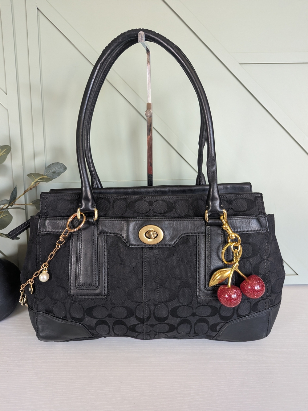 Coach Black Signature Canvas Shoulder Bag with Red Cherry Charm